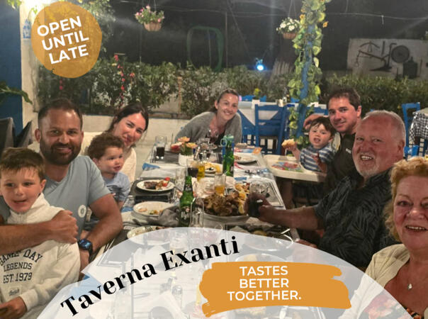 Family and friends enjoying dinner together at Taverna Exanti during a relaxed evening.